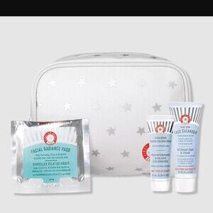 First Aid Beauty Cosmetic bag with three trial size products